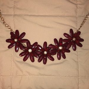 Red flower necklace with gold chain and crystals.